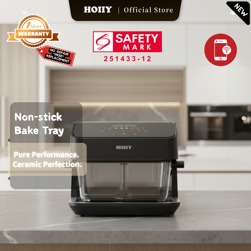 HOIIY 8L Glass Air Fryer accessories: Non-toxic ceramic coated aluminized steel bake tray, 100% PFAS and PTFE free for healthy cooking. Bake tray with ceramic coating with safety mark and warranty badge on a kitchen counter.